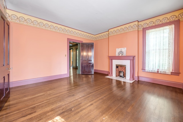 unfurnished living room featuring a fireplace and wood-type flooring