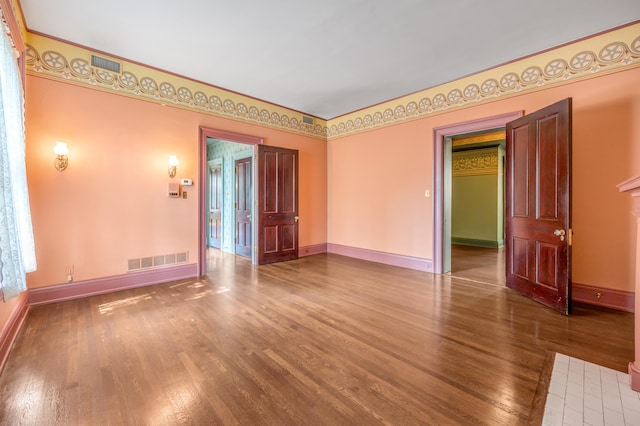 unfurnished room with hardwood / wood-style floors