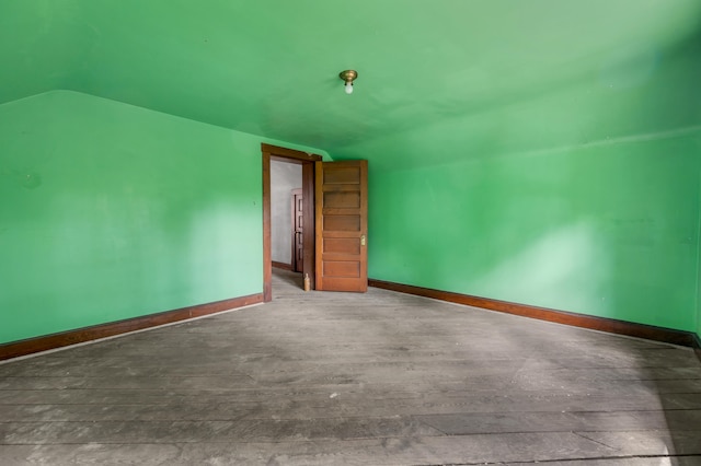 bonus room featuring hardwood / wood-style floors and vaulted ceiling