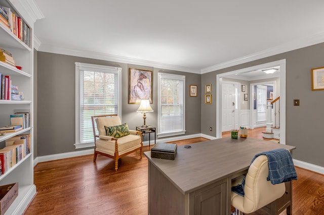 office space with built in shelves, ornamental molding, and dark hardwood / wood-style floors