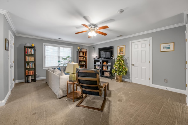 carpeted living room featuring ornamental molding and ceiling fan