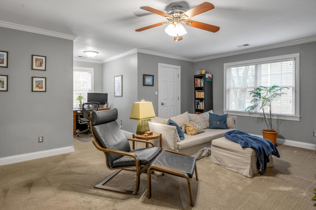 living room with crown molding, ceiling fan, and carpet