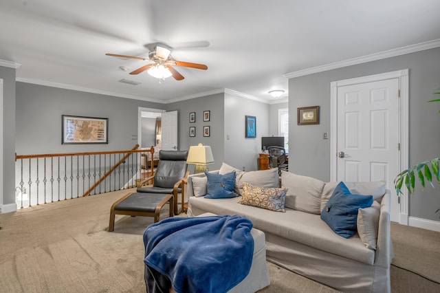 living room featuring ornamental molding, ceiling fan, and carpet