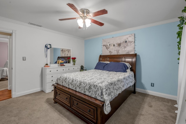 bedroom featuring ceiling fan, ornamental molding, and light carpet