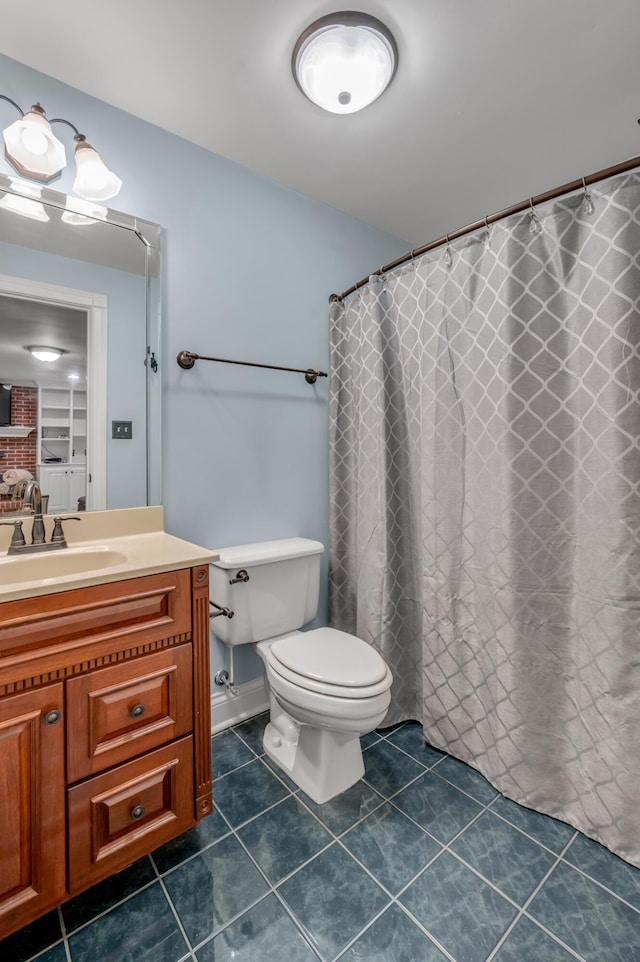 bathroom featuring vanity, a shower with curtain, and toilet