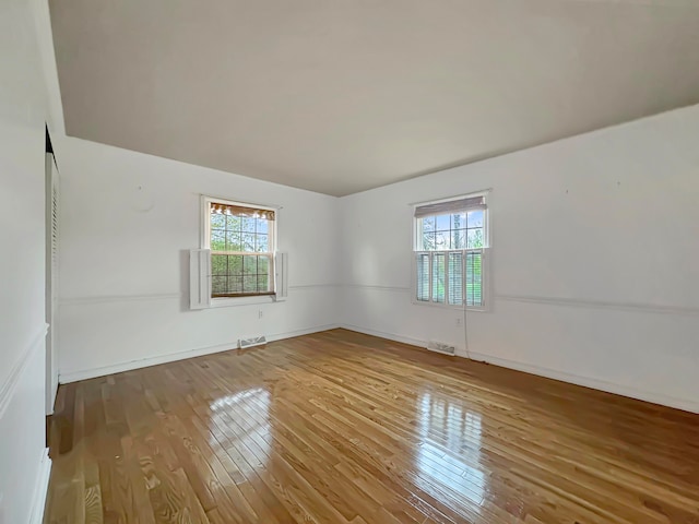 empty room featuring wood-type flooring