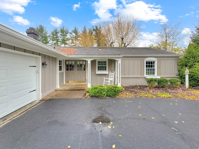 view of exterior entry featuring a garage