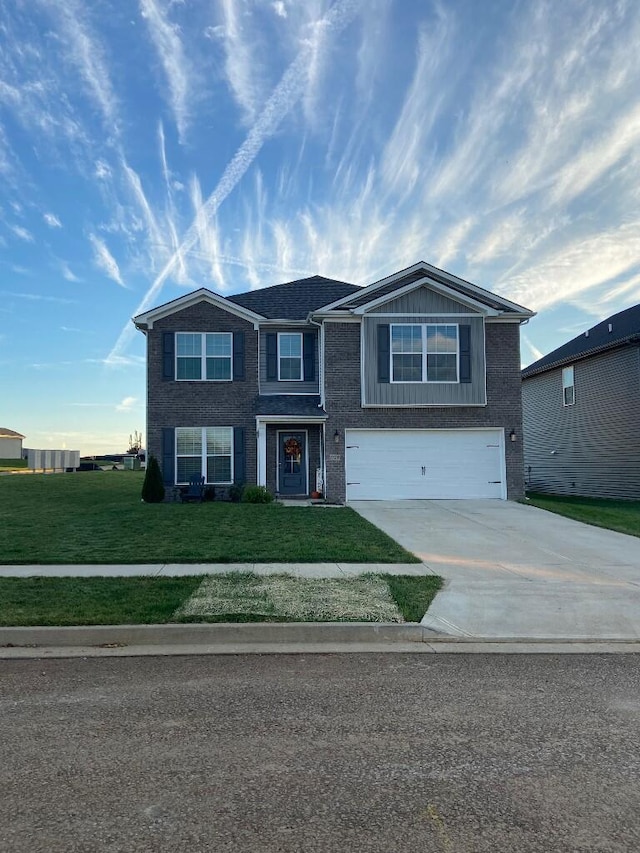 view of front of house featuring a garage and a front lawn