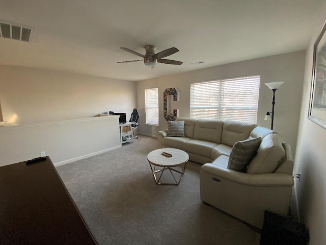 carpeted living room featuring ceiling fan