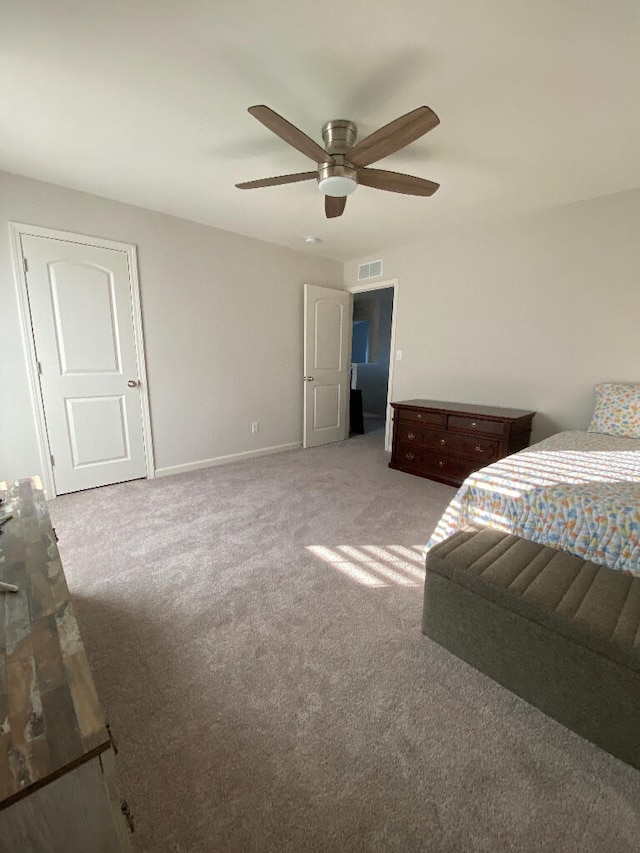 carpeted bedroom featuring ceiling fan