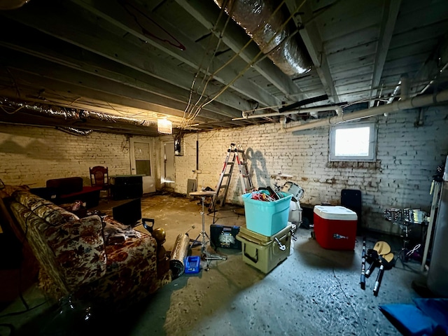 basement featuring brick wall