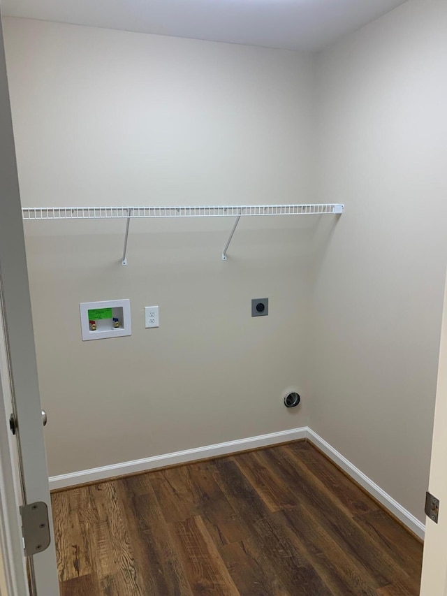 washroom featuring washer hookup, electric dryer hookup, and dark wood-type flooring