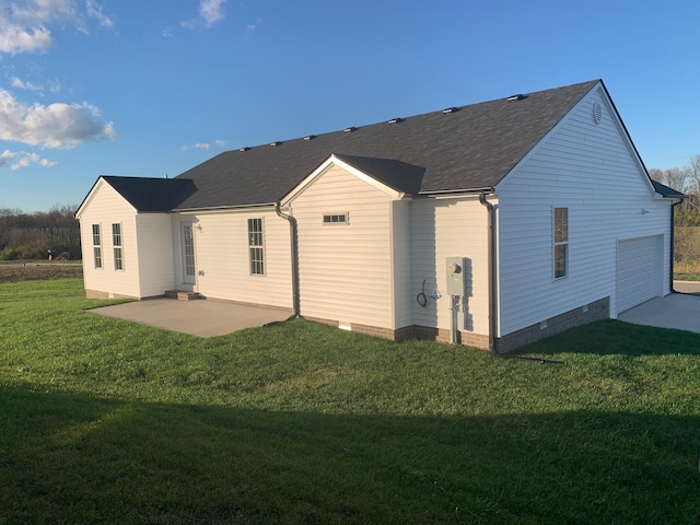 rear view of property featuring a yard and a patio