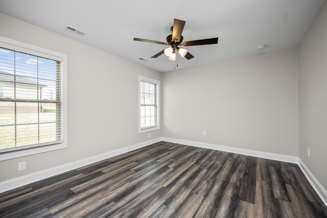 unfurnished room with ceiling fan and dark hardwood / wood-style flooring