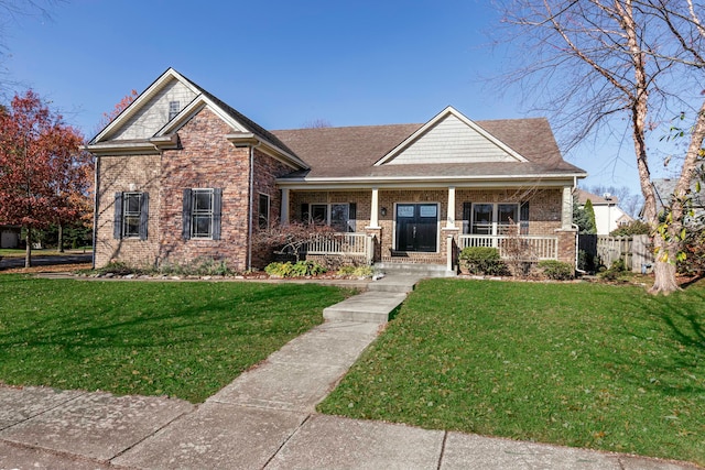 craftsman inspired home with covered porch and a front yard