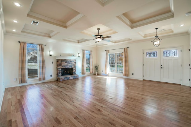 unfurnished living room with light hardwood / wood-style flooring and a healthy amount of sunlight