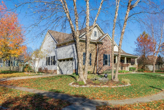 view of front property with a front lawn and a garage