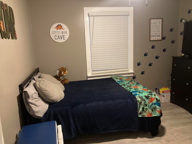 bedroom with light wood-type flooring