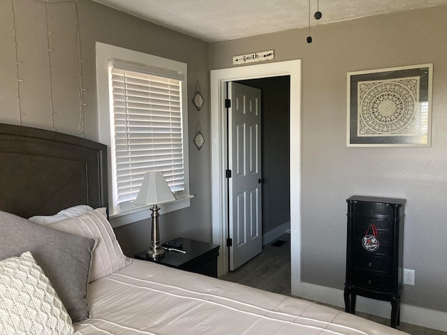 bedroom featuring wood-type flooring