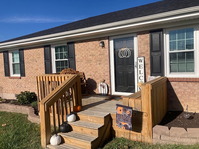 entrance to property with a wooden deck