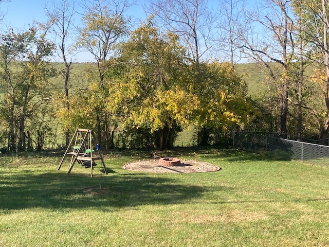 view of yard with a fire pit