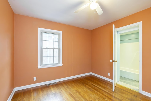 unfurnished bedroom with hardwood / wood-style floors and ceiling fan