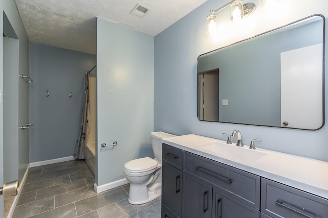 full bathroom with vanity, toilet, a textured ceiling, and shower / bath combo