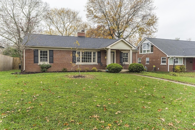 single story home with a front lawn