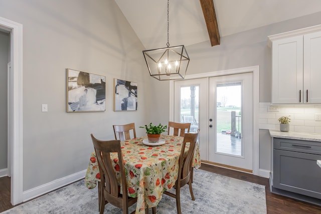 dining room with vaulted ceiling with beams, dark hardwood / wood-style flooring, a chandelier, and french doors