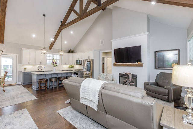 living room with beamed ceiling, high vaulted ceiling, a fireplace, and dark wood-type flooring