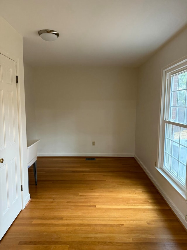 spare room featuring light hardwood / wood-style flooring