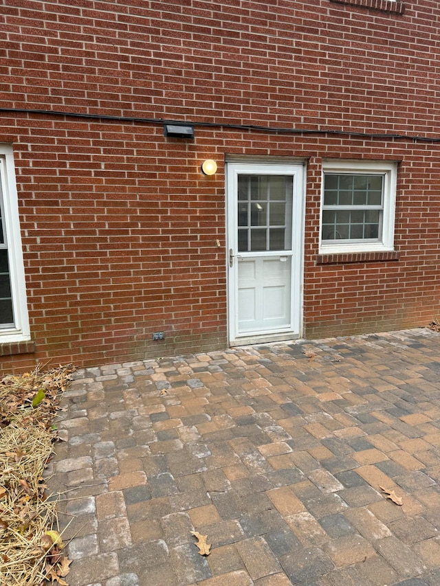 doorway to property with a patio area