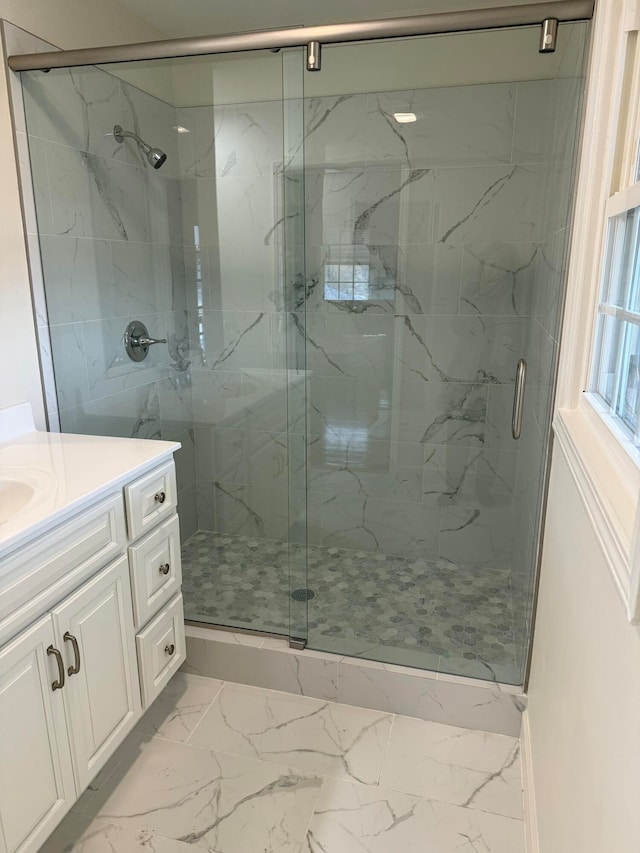 bathroom with vanity and walk in shower