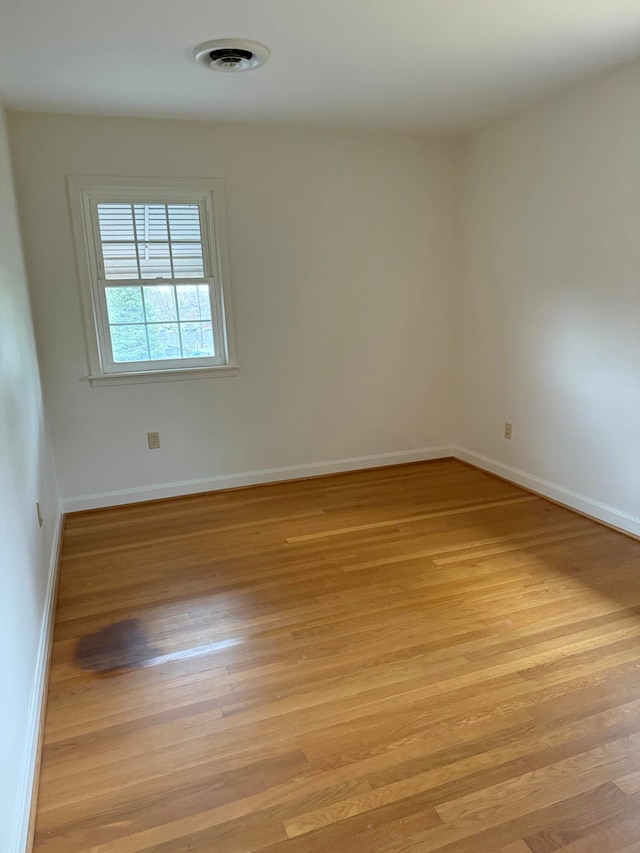 unfurnished room featuring light hardwood / wood-style flooring