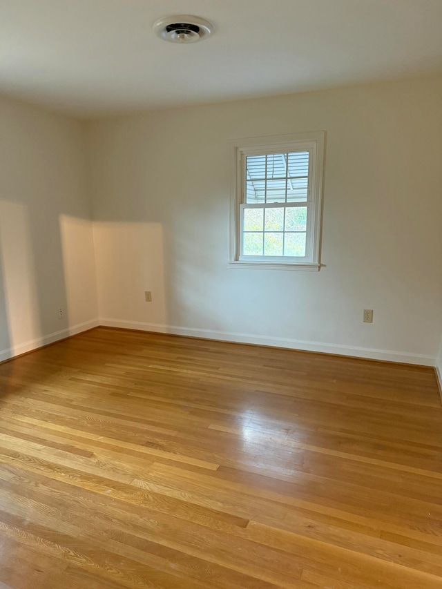 spare room with light hardwood / wood-style floors