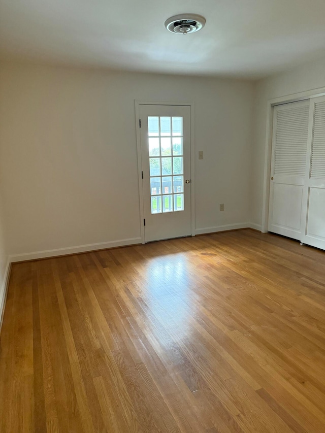 empty room with light wood-type flooring