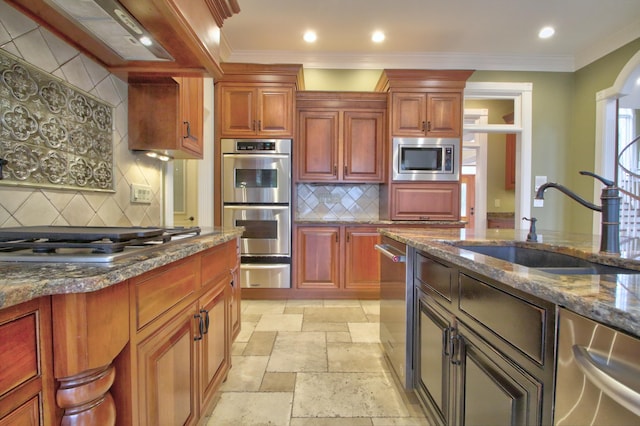 kitchen featuring sink, dark stone countertops, decorative backsplash, stainless steel appliances, and crown molding