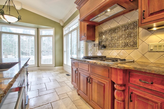 kitchen with backsplash, stainless steel gas cooktop, a healthy amount of sunlight, and custom exhaust hood