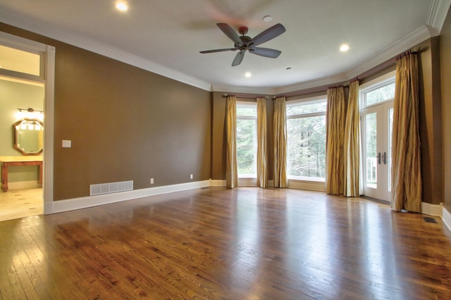 unfurnished room featuring crown molding, ceiling fan, and dark wood-type flooring