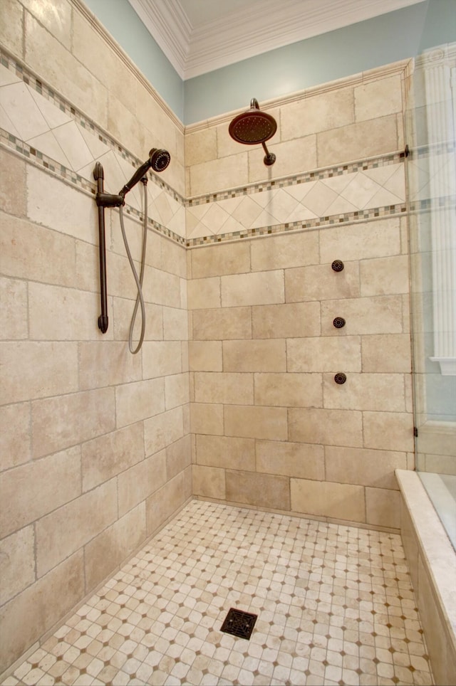 bathroom with tiled shower and crown molding