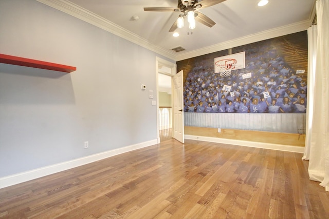 empty room with crown molding, ceiling fan, and hardwood / wood-style flooring