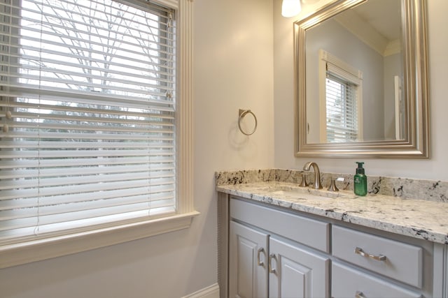 bathroom with vanity and crown molding