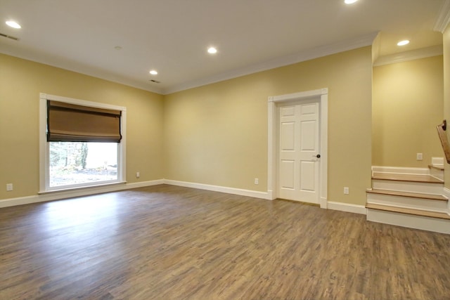 unfurnished room featuring hardwood / wood-style flooring and ornamental molding