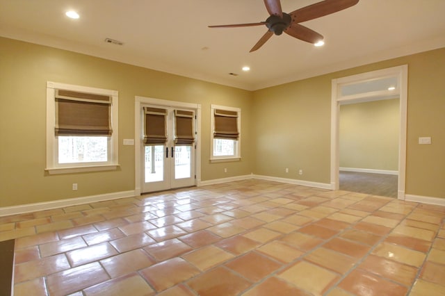 spare room with ceiling fan, light tile patterned flooring, ornamental molding, and french doors