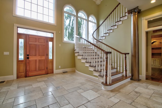 entryway with a towering ceiling