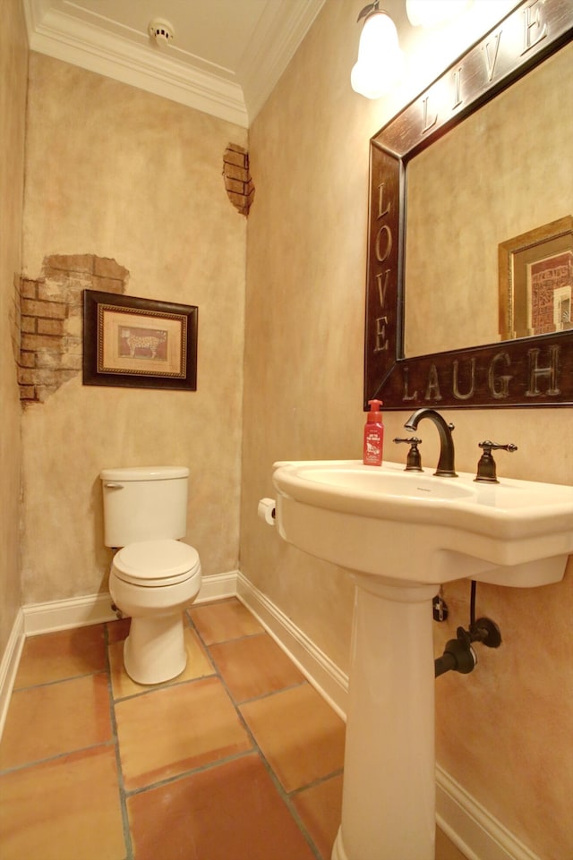 bathroom with toilet and crown molding