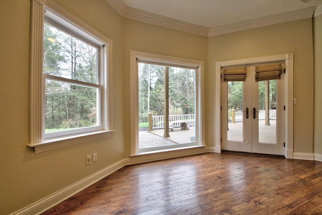 entryway featuring ornamental molding, dark hardwood / wood-style flooring, and french doors