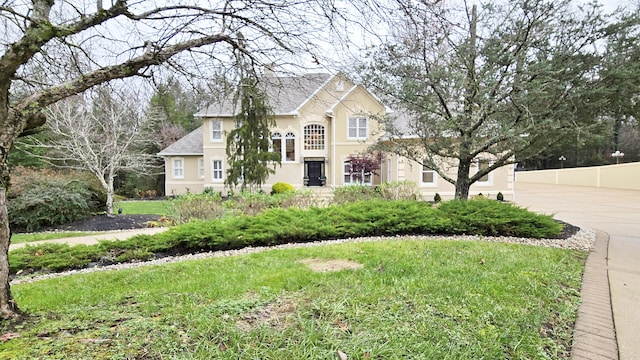 view of property with a front lawn