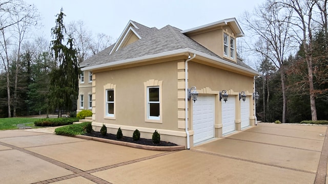 view of side of home with a garage