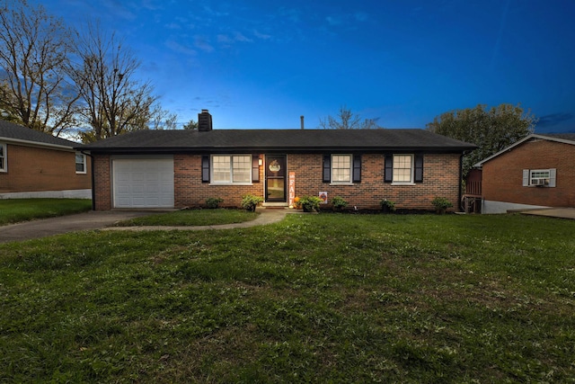 ranch-style house with a garage and a front yard